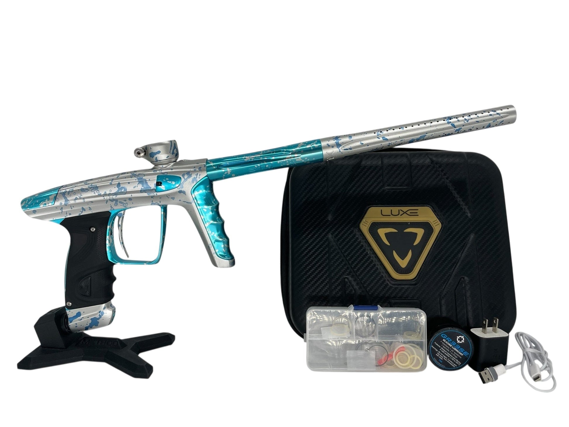 Used Dlx Luxe X Paintball Gun Silver Teal Splash Paintball Gun from CPXBrosPaintball Buy/Sell/Trade Paintball Markers, New Paintball Guns, Paintball Hoppers, Paintball Masks, and Hormesis Headbands